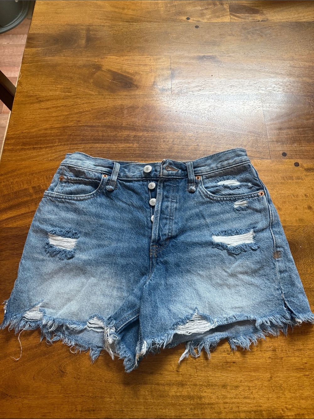 We The Free Distressed Light Blue Denim Button-Front Shorts